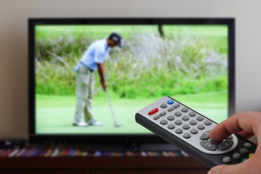 Zapping tv during golf clipart