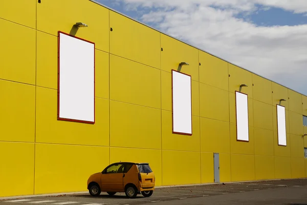 Blank billboards in a yellow wall — Stock Photo, Image