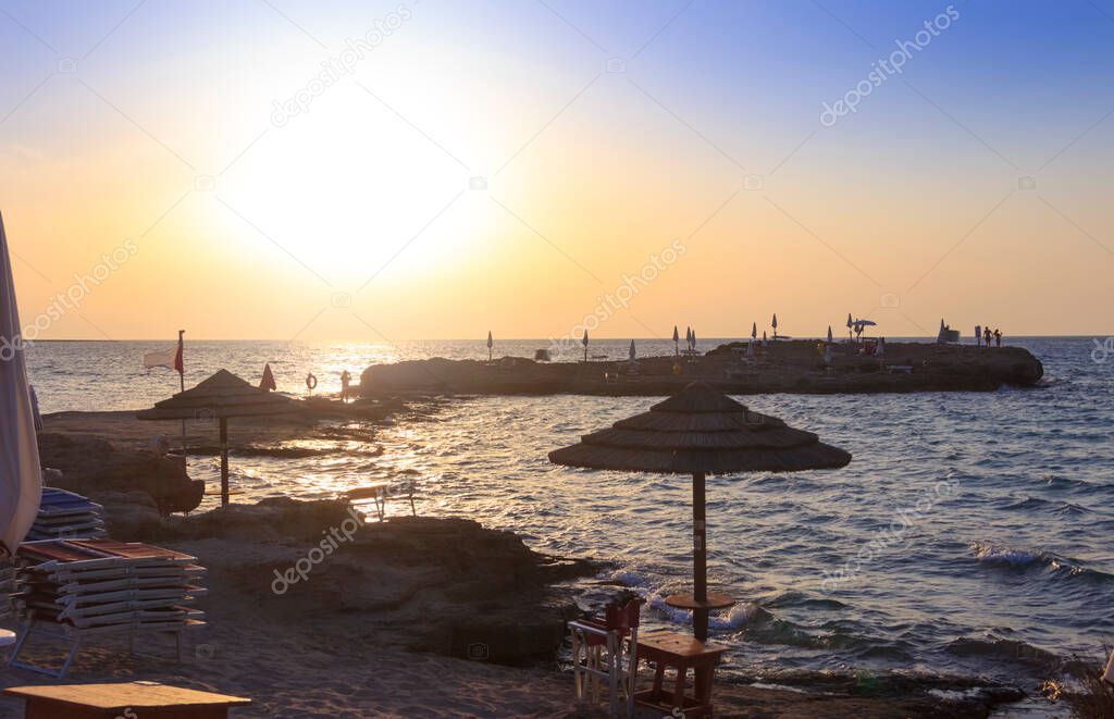 Punta della Suina beach in Salento, Apulia. Italy. It's surrounded by the  Mediterranean scrub and by pine forest, boasts two small sandy bays and a small islet, which is almost separated by coast.