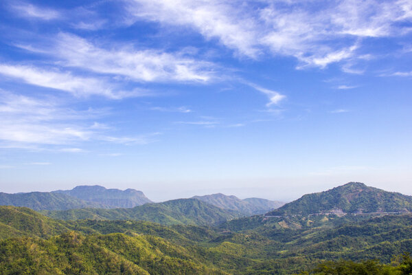 Mountain range under cloud blue sky