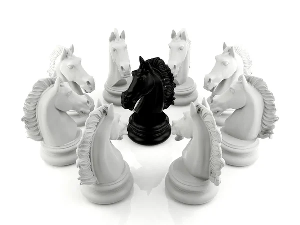 Black knight chess surrounded by a group of white knight chess — Stock Photo, Image