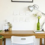 Wooden table and decorative elements in white room