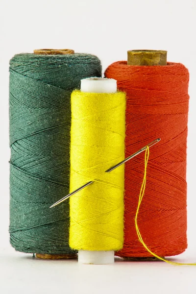 Spools of colored thread on a white background — Stock Photo, Image