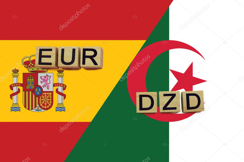 Spain and Algeria currencies codes on national flags background. International money transfer concept