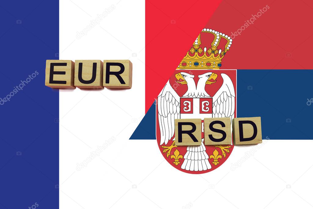 France and Serbia currencies codes on national flags background. International money transfer concept