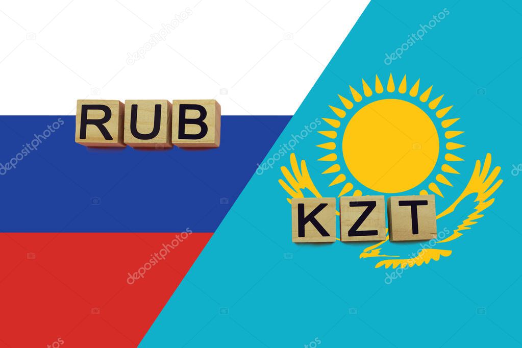 Russia and Kazakhstan currencies codes on national flags background. International money transfer concept