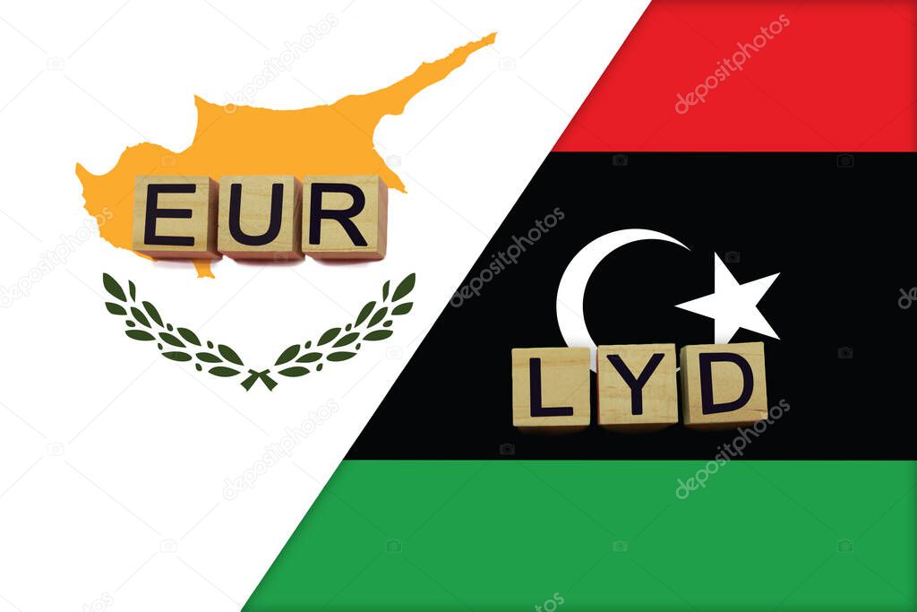 Cyprus and Libya currencies codes on national flags background. International money transfer concept