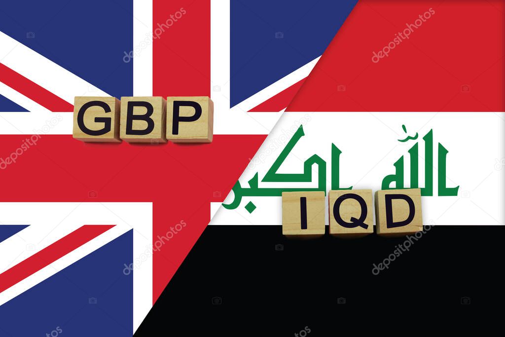 United Kingdom and Iraq currencies codes on national flags background. International money transfer concept