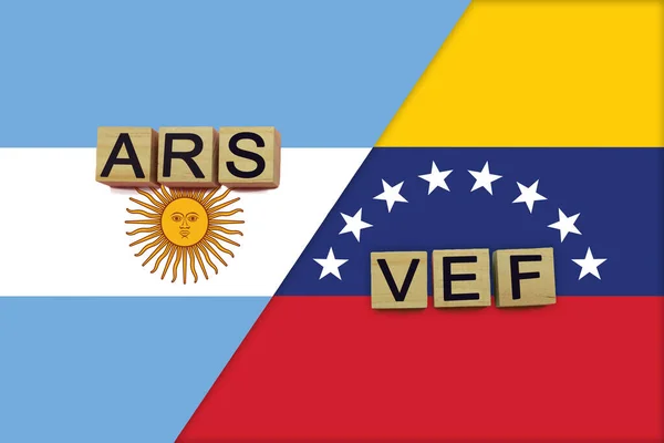 Argentina and Venezuela currencies codes on national flags background. International money transfer concept
