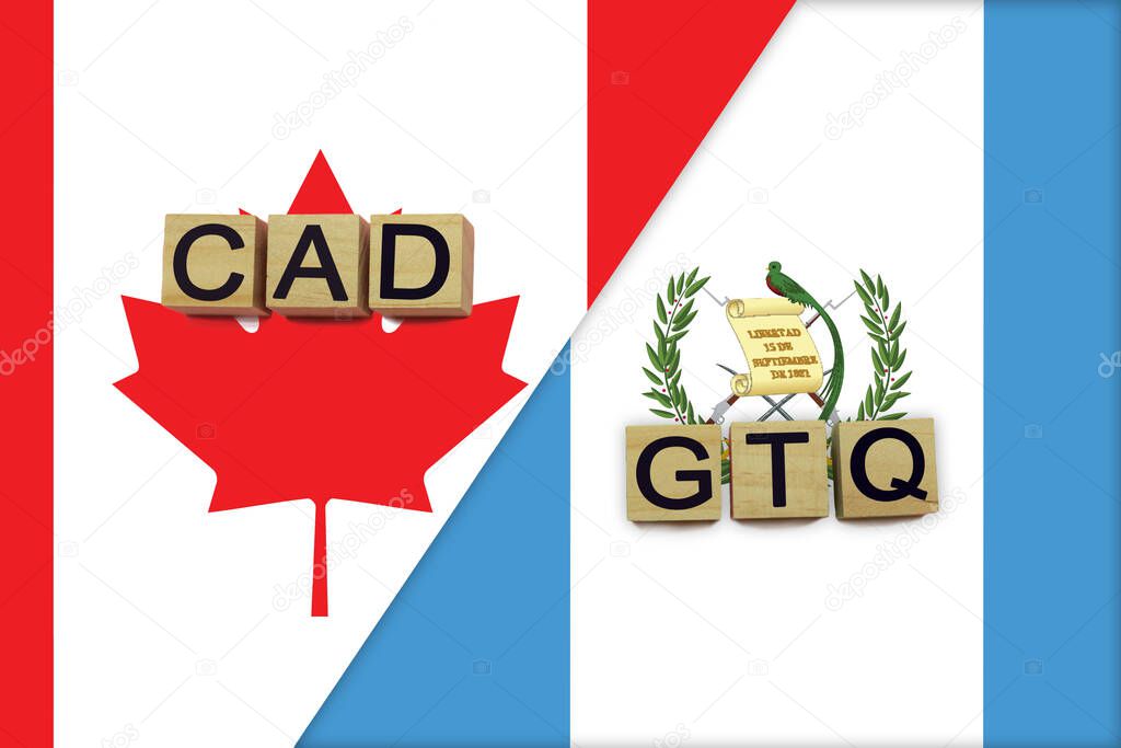 Canada and Guatemala currencies codes on national flags background. International money transfer concept