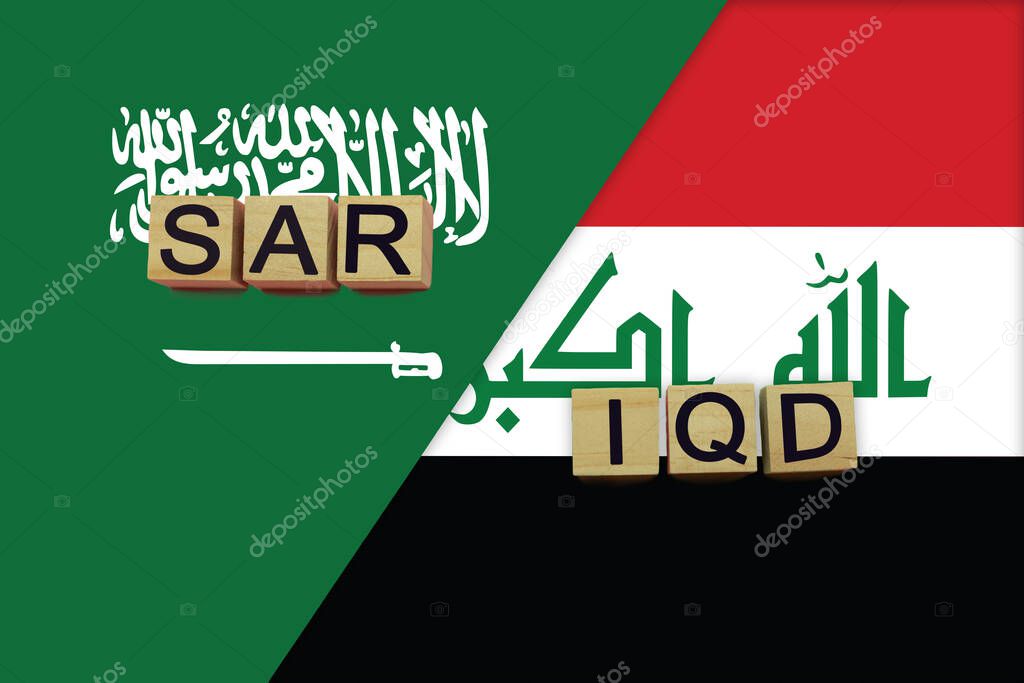 Saudi Arabia and Iraq currencies codes on national flags background. International money transfer concept