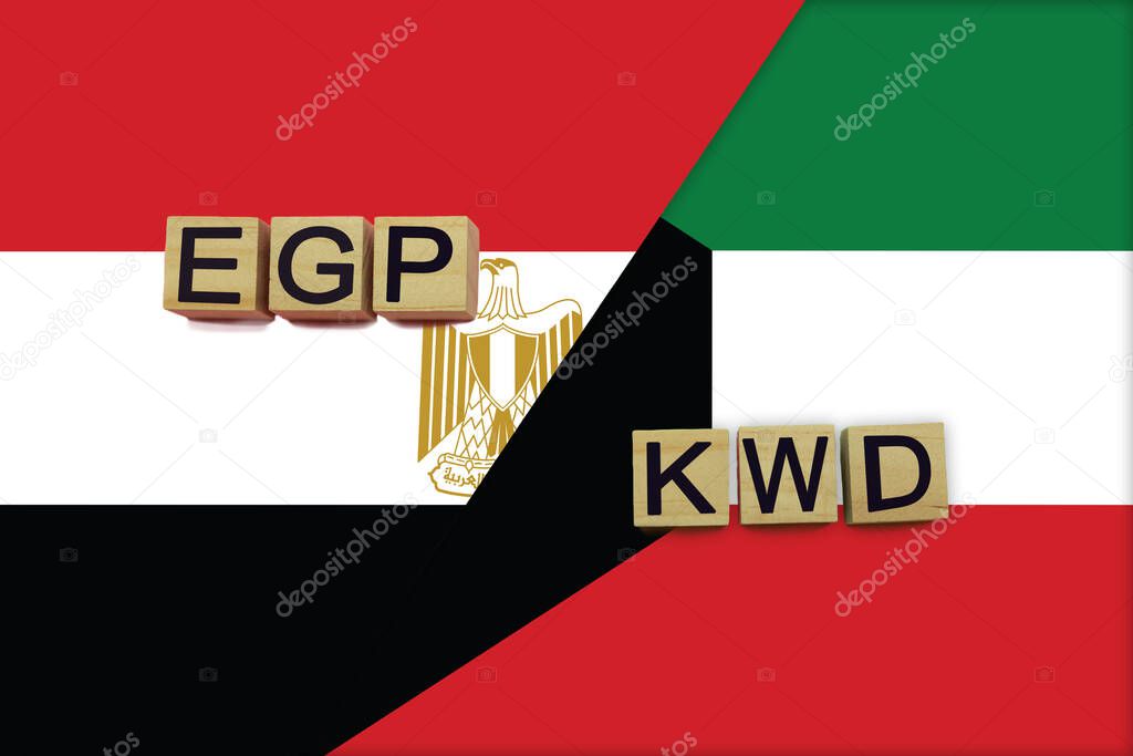 Egypt and Kuwait currencies codes on national flags background. International money transfer concept