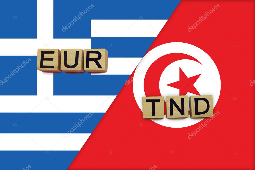 Greece and Tunisia currencies codes on national flags background. International money transfer concept