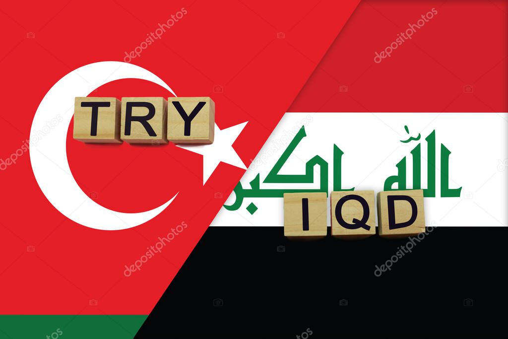 Turkey and Iraq currencies codes on national flags background. International money transfer concept