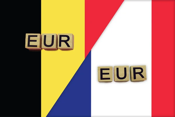 Belgium and France currencies codes on national flags background. International money transfer concept