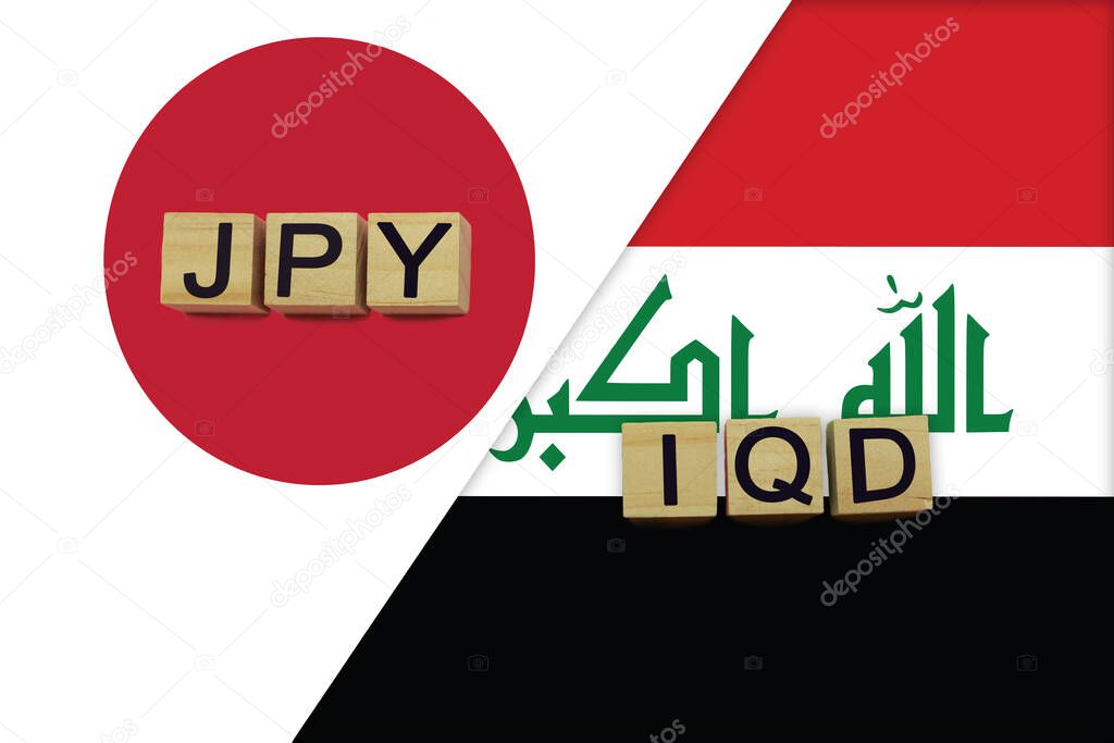 Japan and Iraq currencies codes on national flags background. International money transfer concept