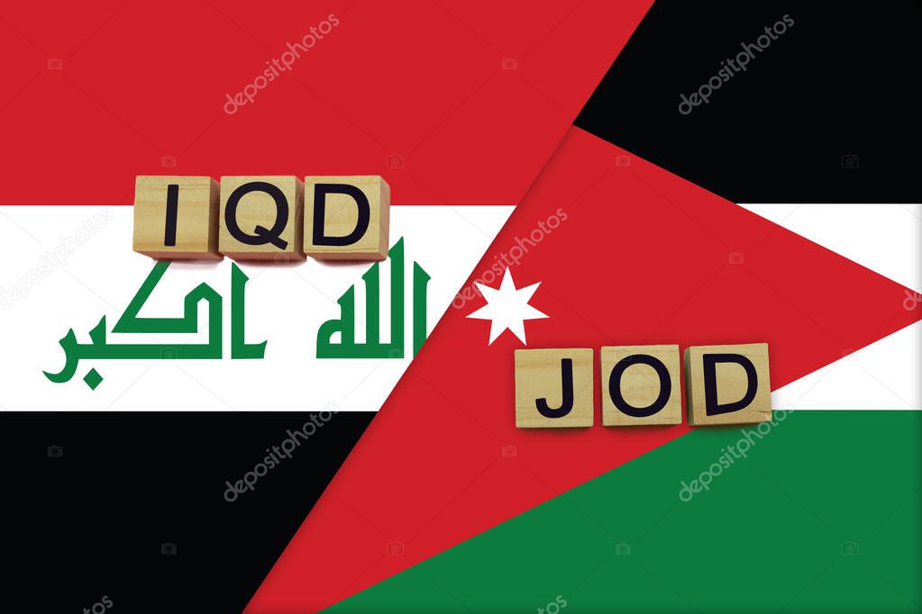 Iraq and Jordan currencies codes on national flags background. International money transfer concept