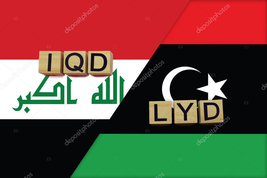 Iraq and Libya currencies codes on national flags background. International money transfer concept