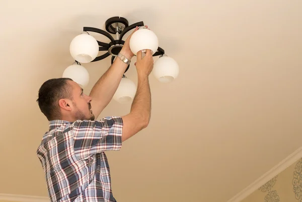 Man Changes Electric Light Bulb Energy Efficiency Closeup Man Hand — Stock Photo, Image