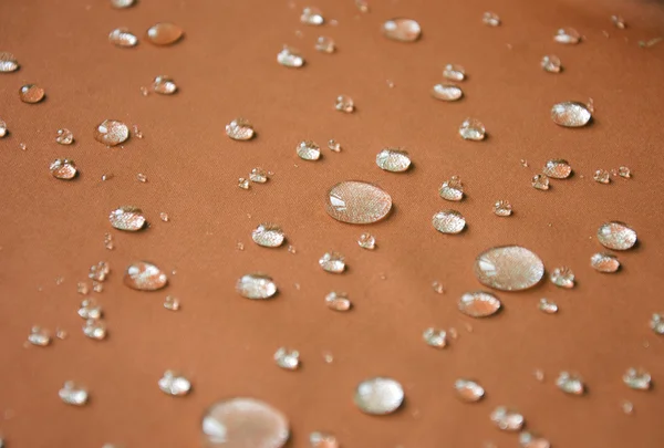 Wasserdichtes Textil mit wärmeren Tropfen — Stockfoto