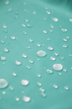 Waterproof coating textile, background with water drops. clipart