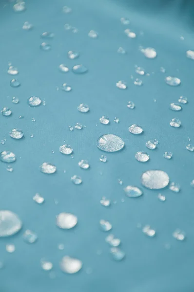 Waterdichte coating textiel, achtergrond met water druppels. — Stockfoto