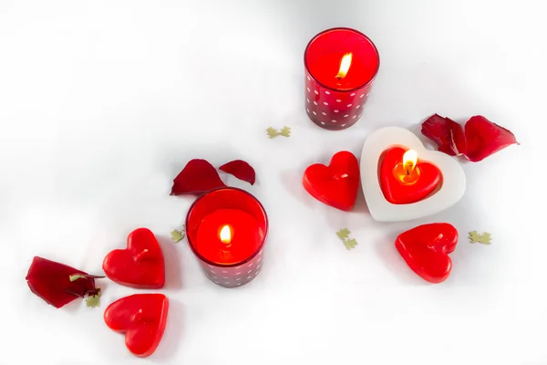 Valentines Day hearts,  candles and rose petals on white backgro — Stock Photo, Image