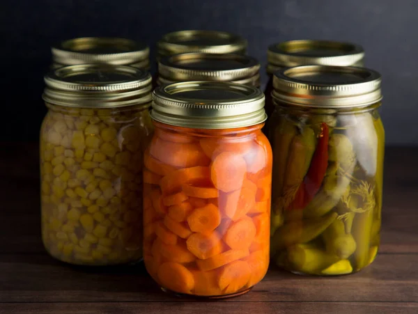 Various Types Canned Vegetables Wooden Table Dark Environment — Stock Photo, Image