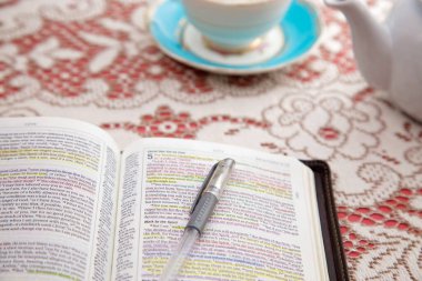 Bible Set Out with Tea for a Ladies Bible Study clipart