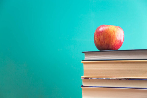 Education Background with a Stack of Books and an Apple