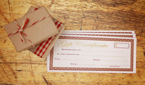 Blank Gift Voucher on a Wooden Table