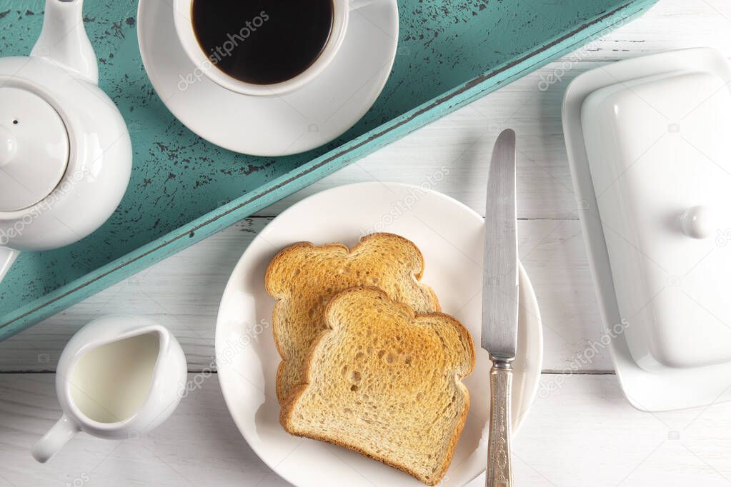 A Breakfast of Toast and Hot Coffee on a Tray