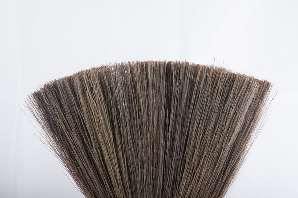 Broom isolated on white background