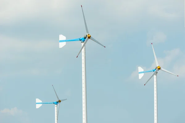 Eco energy - wind turbines ,blue sky background