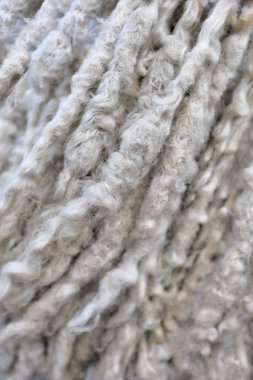 Kıvırcık kabarık yün ip ile bej arka plan
