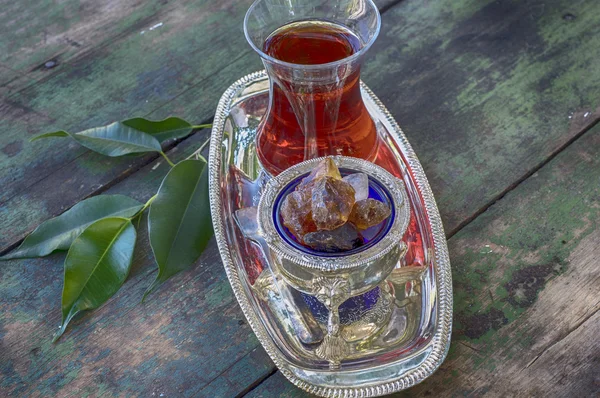 Black tea Turkish glass on a silver platter — Stock Photo, Image