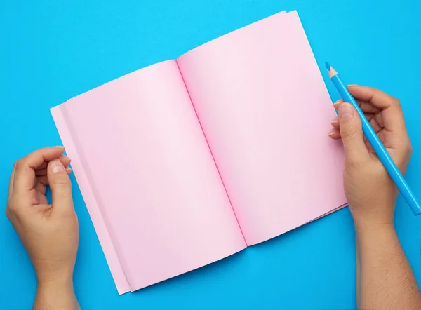 Two Female Hands Holding Open Notepad Empty Pink Sheets Blue — Stock Photo, Image