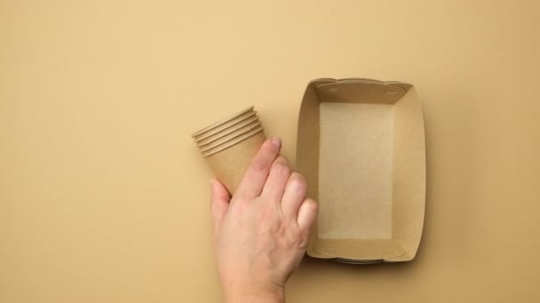 Female Hand Puts Disposable Paper Plates Cups Wooden Forks Toothbrushes — Αρχείο Βίντεο