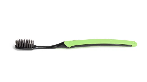 Grüne Zahnbürste Aus Kunststoff Isoliert Auf Weißem Hintergrund Nahaufnahme — Stockfoto