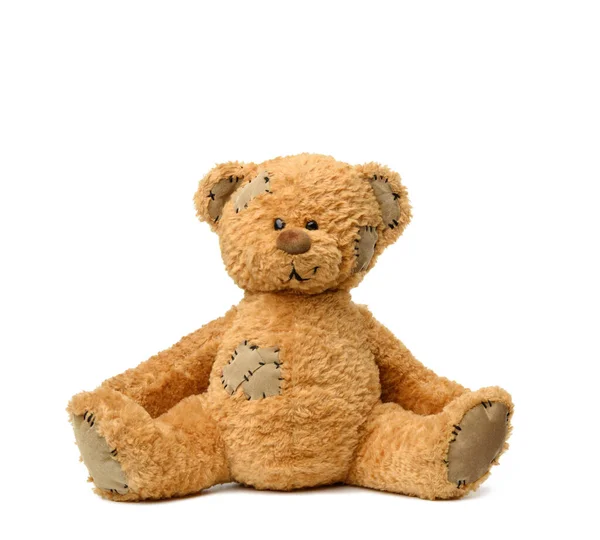 Brown Teddy Bear Sits White Background Toy Patches — Stock Photo, Image