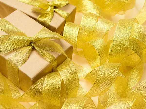 Gift Wrapped Brown Paper Twisted Golden Ribbon Background Festive Background — Stock Photo, Image