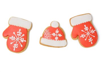 Eldiven şeklinde fırında zencefilli ekmek ve kırmızı kremayla kaplı, klasik Noel tatlısı.