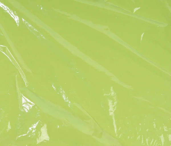 Tekstur Dari Polietilena Transparan Kusut Pada Latar Belakang Hijau Bingkai — Stok Foto