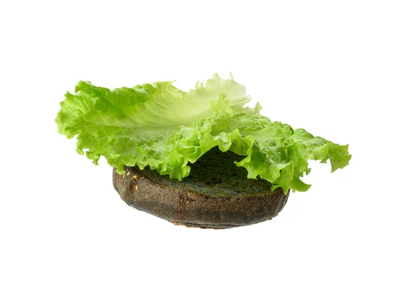 Frunze Salată Verde Află Jumătate Chifle Rotunde Negre Alimentele Sunt — Fotografie, imagine de stoc