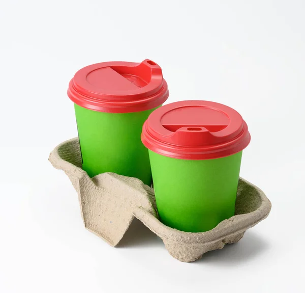 Disposable Green Cups Red Plastic Lid Stand Holder White Background — Stock Photo, Image