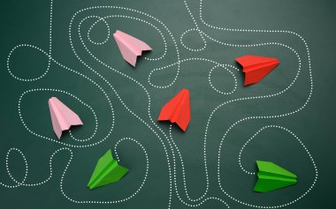 group of paper planes with long tangled paths on a green background. concept of a strong leader with extraordinary thinking, quick decision-making. Finding the optimal and simple solution in business clipart