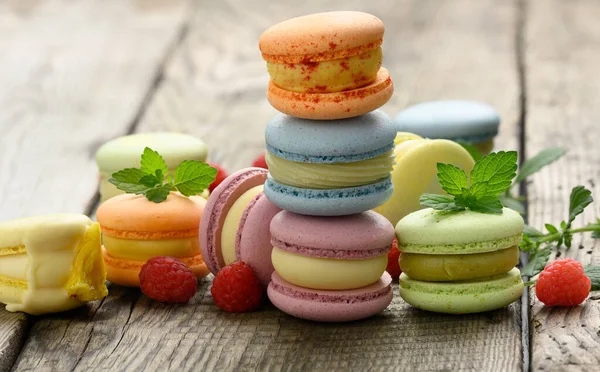 Stack Baked Multicolored Macarons Different Flavors Gray Wooden Table Delicious — Stock Photo, Image