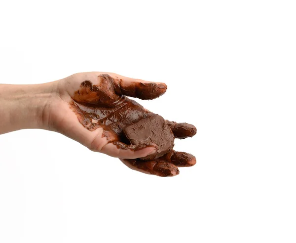 배경에 초콜릿을 손으로 초콜릿 조각을 — 스톡 사진
