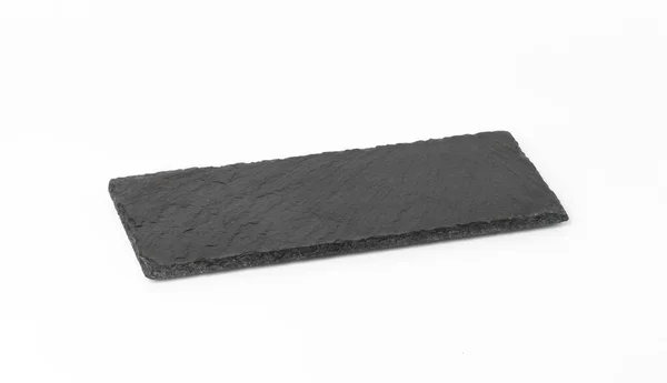 白い背景に隔離された長方形の黒い石板料理を出すための道具 — ストック写真