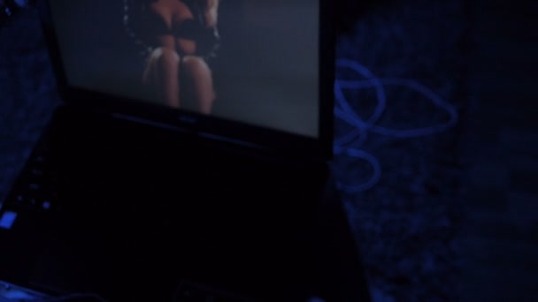 In front of computer monitor where sexy girl on a screen — Stock Video